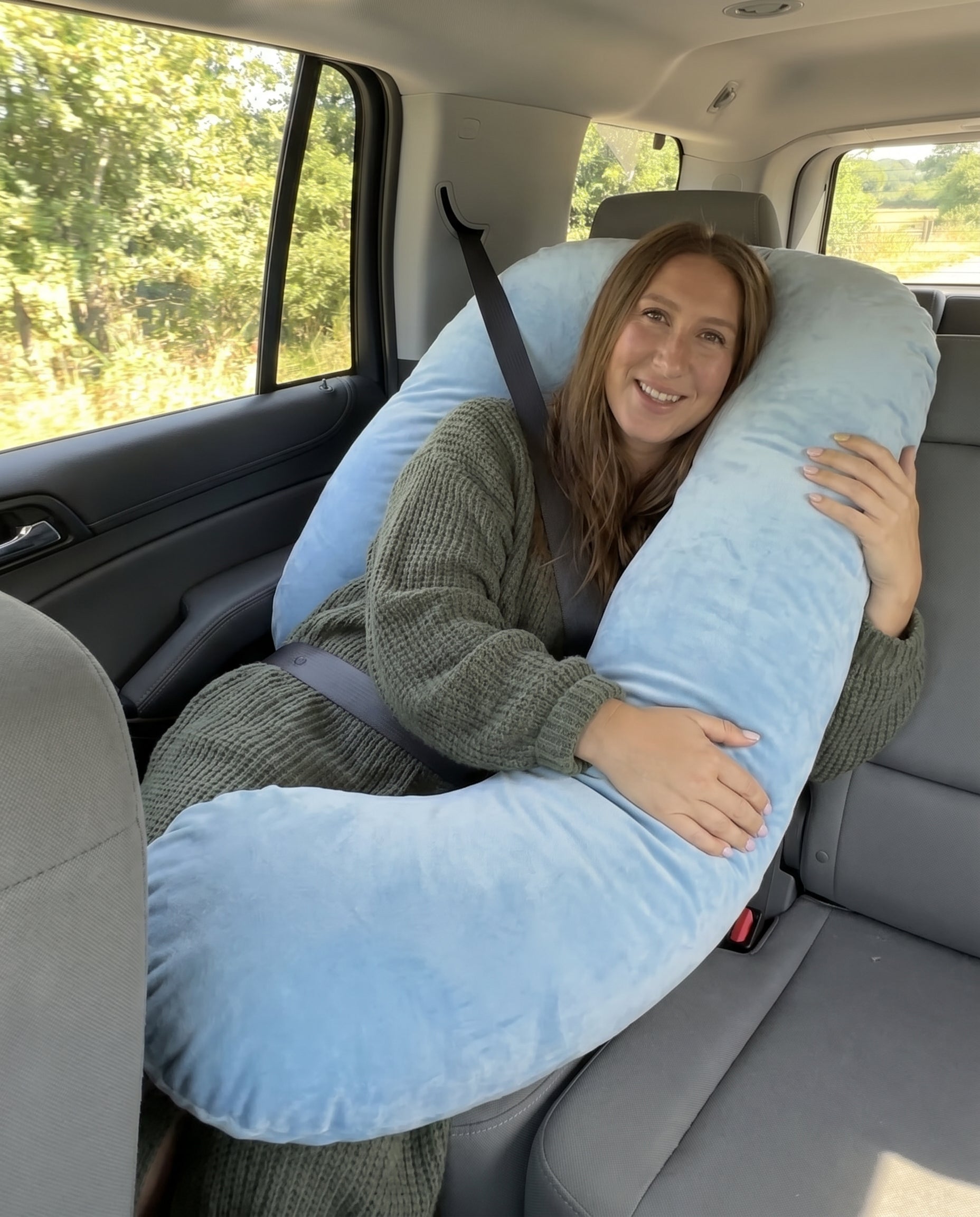 Passenger Princess Pillow Light Blue in car with seatbelt